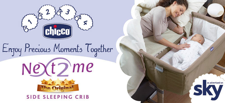 Image of mother putting baby to sleep in a Chicco next 2 me bedside crib