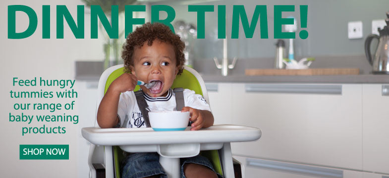 Baby in an highchair eating with caption Dinner time! Feed hungry tunnies with our range of baby weaning products